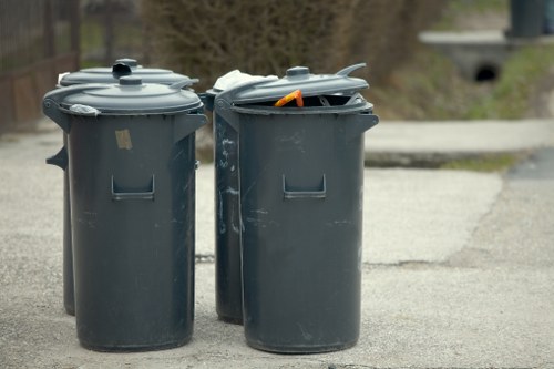 Close-up of gardeners sorting green waste during a Bromley clearance job